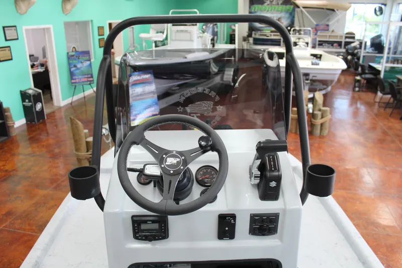 Slide: The Image of 2026 Freedom Boats Chiquita deck with marbled finish and quilted seat design. - 12