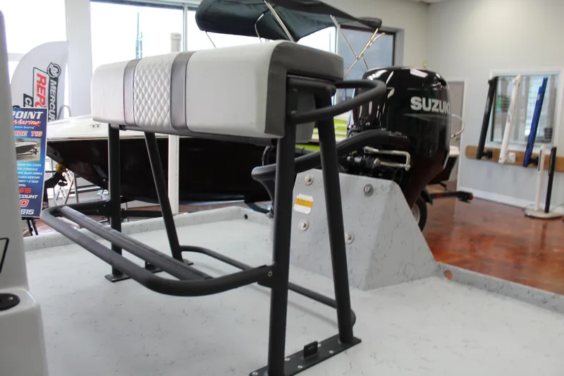 Slide: The Image of 2026 Freedom Boats Chiquita with Suzuki outboard motor, featuring a sturdy bench seat. - 8