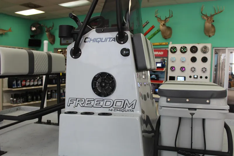Slide: The Image of 2026 Freedom Boats Chiquita console with steering wheel and controls. - 10