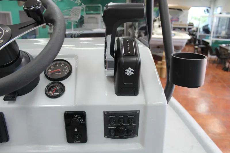 Slide: The Image of 2026 Freedom Boats Chiquita on trailer in parking lot, sunny day. - 14