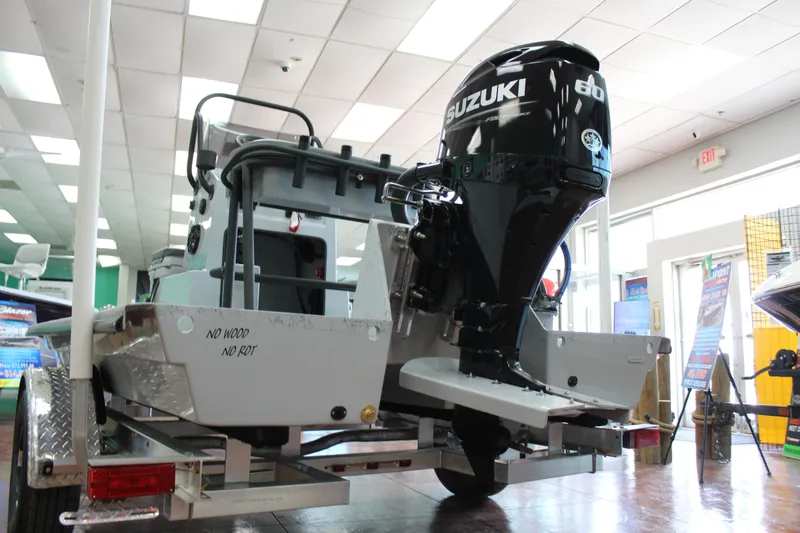 Slide: The Image of 2026 Freedom Boats Chiquita with durable, rot-resistant design at a dealership. - 3