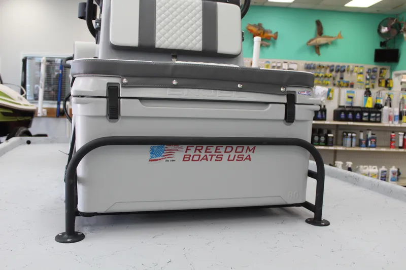 Slide: The Image of 2026 Freedom Boats Chiquita console with rod holders and steering wheel. - 9