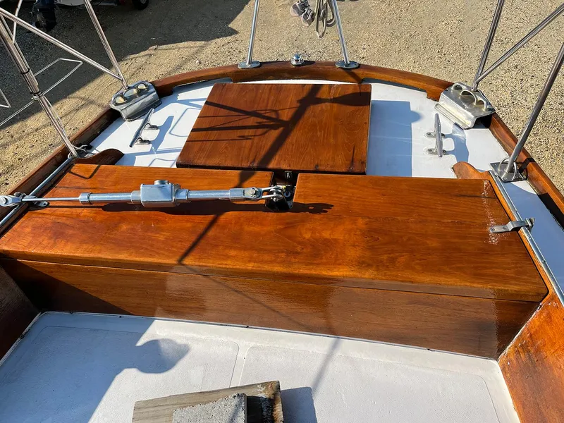 Slide: The Image of 1968 Hinckley Bermuda 40 sailboat deck with polished wood finish and rigging details. - 15