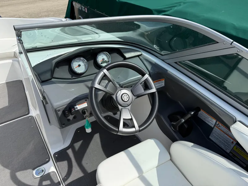 Slide: The Image of 2016 Yamaha Boats SX190 cockpit with steering wheel and dashboard gauges. - 3