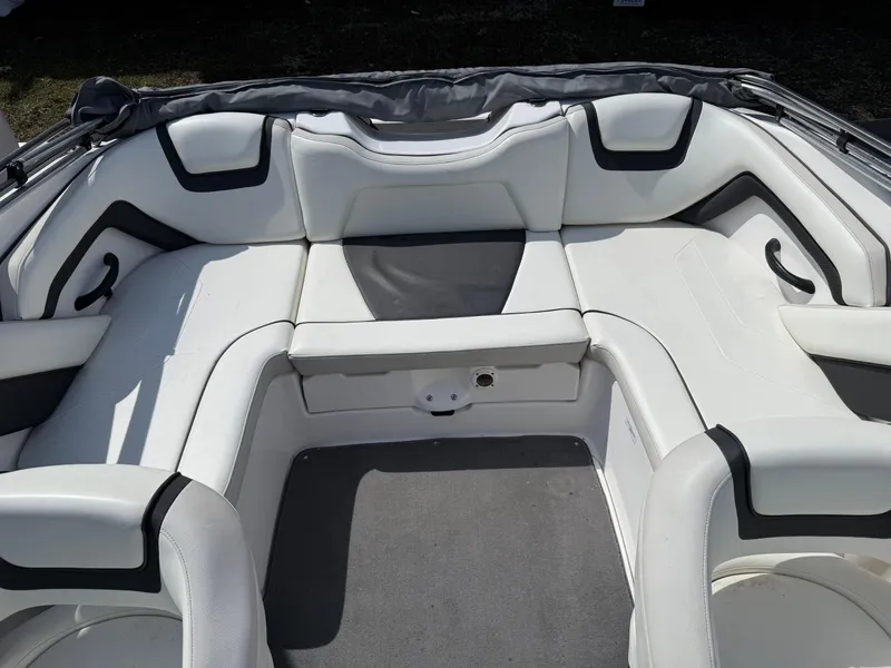 Slide: The Image of 2016 Yamaha SX190 boat interior with white cushioned seating and gray accents. - 5