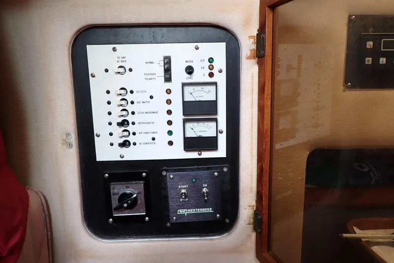 Slide: The Image of Electrical control panel on a 1987 Sea Ray 300 Weekender boat. - 16