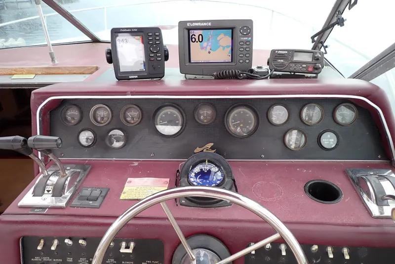 Slide: The Image of Dashboard of a 1987 Sea Ray 300 Weekender boat with navigation instruments. - 17