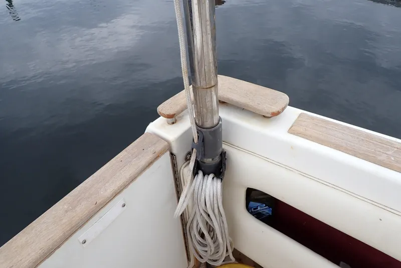 Slide: The Image of 1987 Sea Ray 300 Weekender boat deck with railing and coiled rope. - 26