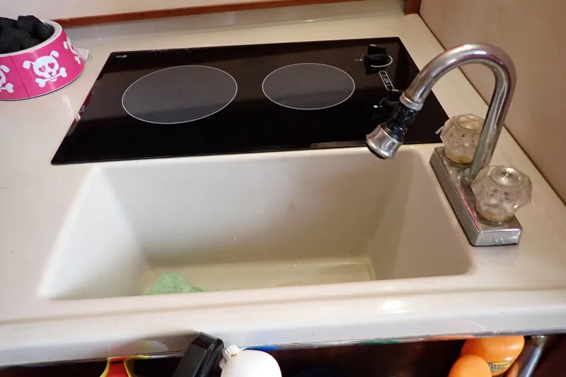 Slide: The Image of Sink and stovetop in 1987 Sea Ray 300 Weekender boat kitchen. - 35