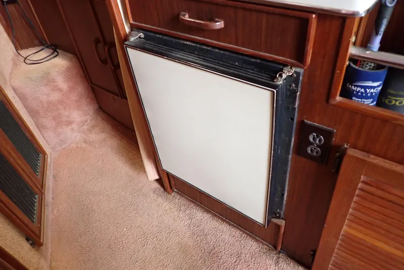Slide: The Image of 1987 Sea Ray 300 Weekender interior with built-in refrigerator and wood cabinetry. - 36