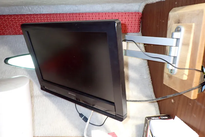 Slide: The Image of Wall-mounted TV inside 1987 Sea Ray 300 Weekender boat cabin. - 41