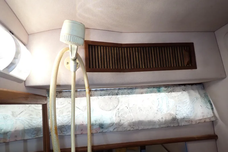 Slide: The Image of Interior of 1987 Sea Ray 300 Weekender with lamp and wooden vent. - 44