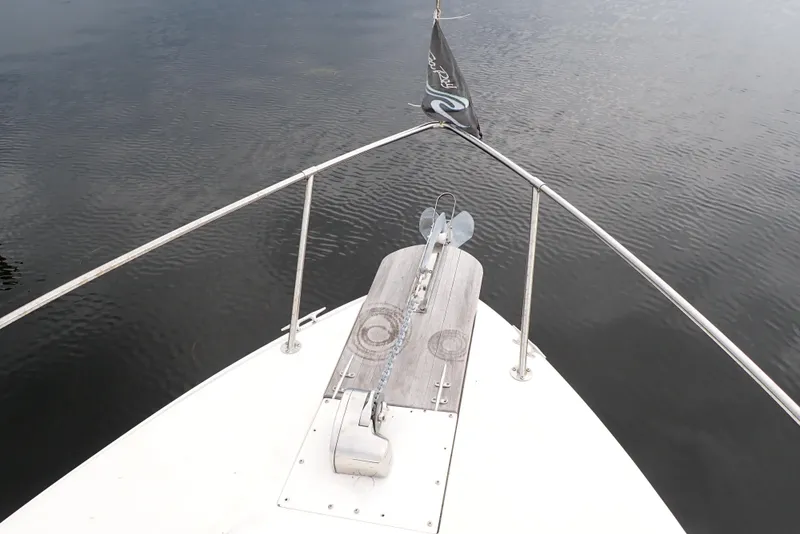 Slide: The Image of Bow view of 1987 Sea Ray 300 Weekender on calm water. - 8