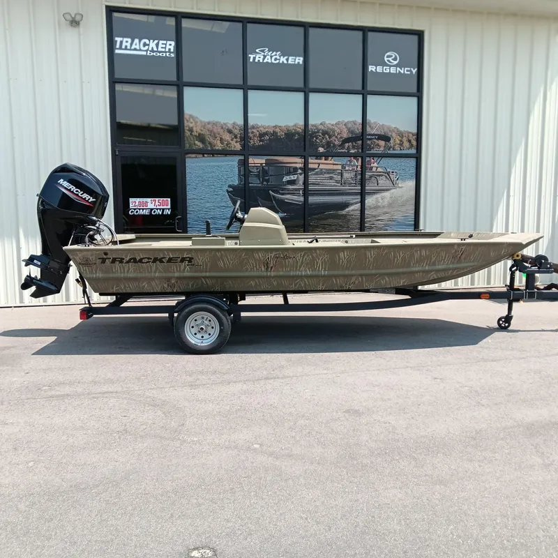 The Image of 2025 Tracker Grizzly 1648 SC boat on trailer outside dealership. - 0