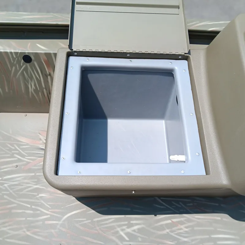 Slide: The Image of Open storage compartment on 2025 Tracker Grizzly 1648 SC boat. - 8