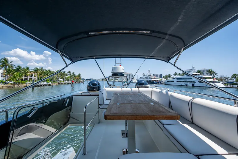 Slide: The Image of 2015 Beneteau Monte Carlo yacht with spacious deck and seating, cruising on a sunny day. - 28