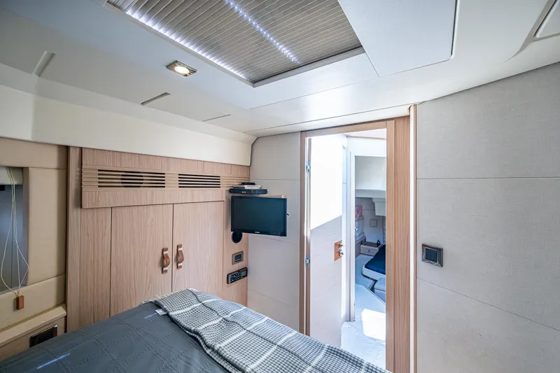Slide: The Image of Luxurious interior of 2015 Beneteau Monte Carlo yacht cabin with modern amenities. - 39
