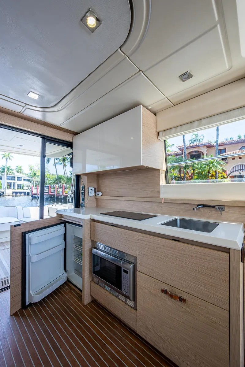 Slide: The Image of 2015 Beneteau MONTE CARLO yacht kitchen with modern appliances and sleek design. - 48