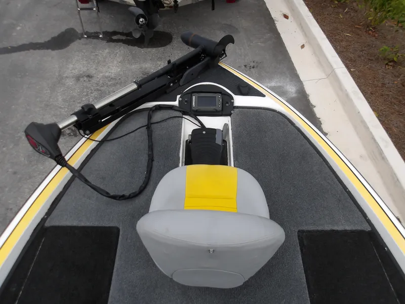 Slide: The Image of 2006 Triton 20X2 boat interior with gray seat and mounted equipment. - 7