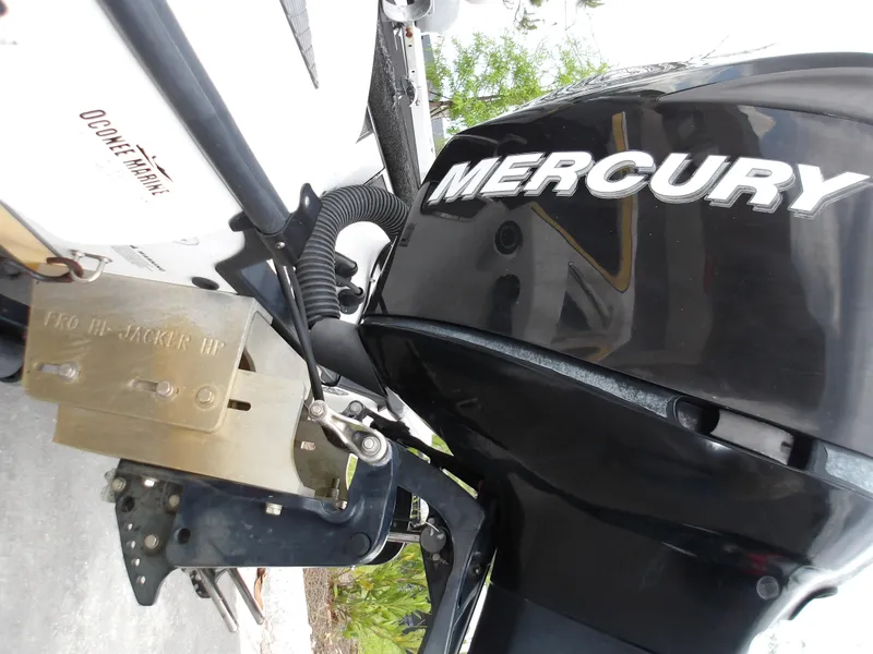 Slide: The Image of 2006 Triton 20X2 boat with Mercury outboard motor, close-up view. - 9