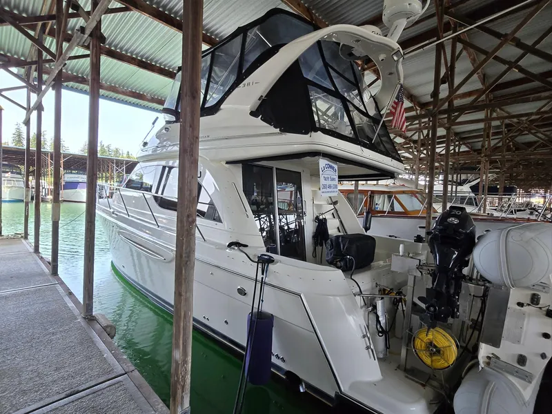 Slide: The Image of 2004 Meridian 381 Sedan yacht docked in a covered marina. - 12