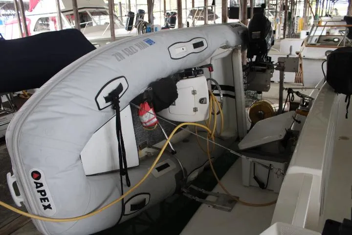 Slide: The Image of Inflatable boat on a 2004 Meridian 381 Sedan yacht, docked in a marina. - 14