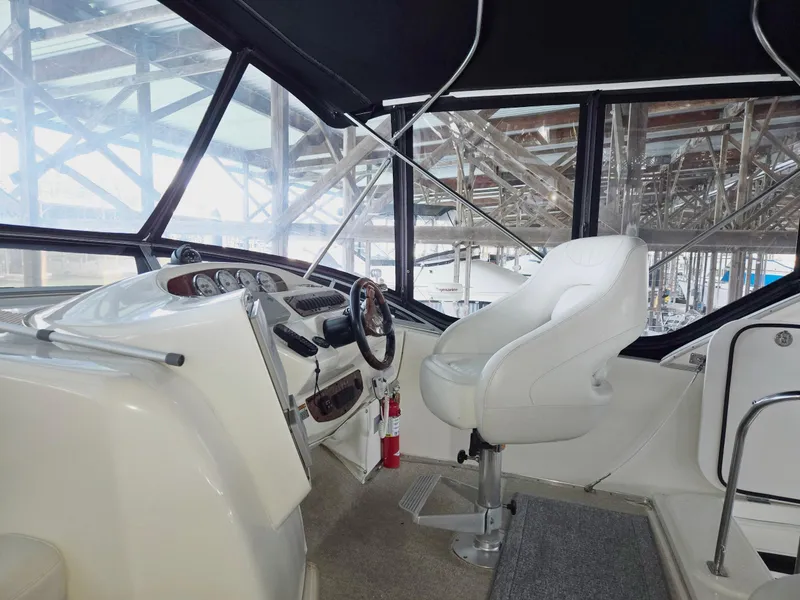 Slide: The Image of 2004 Meridian 381 Sedan helm with white captain's chair and steering wheel. - 20