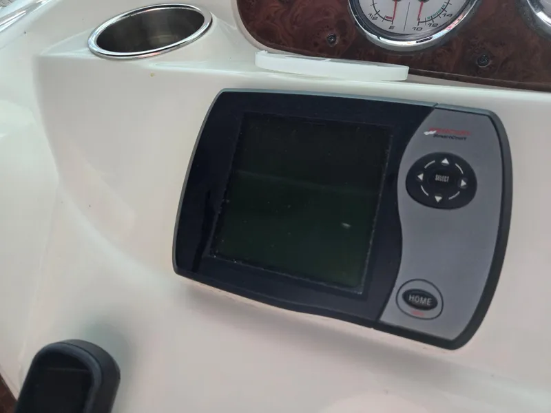 Slide: The Image of Control panel of a 2004 Meridian 381 Sedan boat with navigation display. - 27