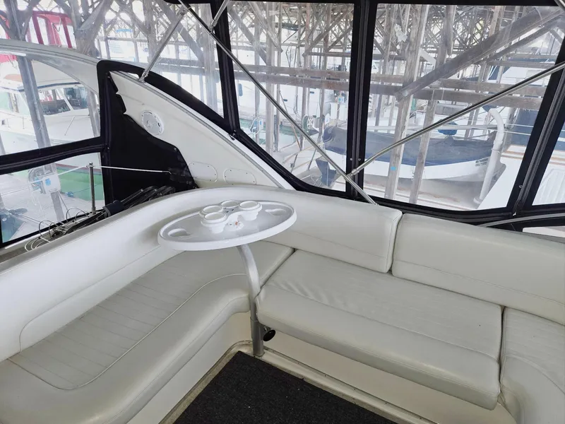 Slide: The Image of Luxurious interior of 2004 Meridian 381 Sedan yacht with white seating and table. - 29
