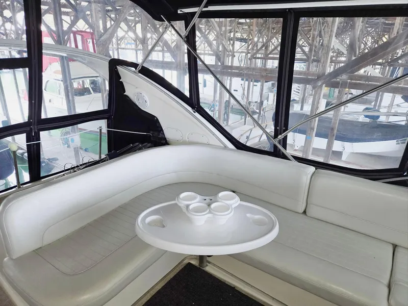 Slide: The Image of Luxurious interior of 2004 Meridian 381 Sedan yacht with white seating and table. - 30