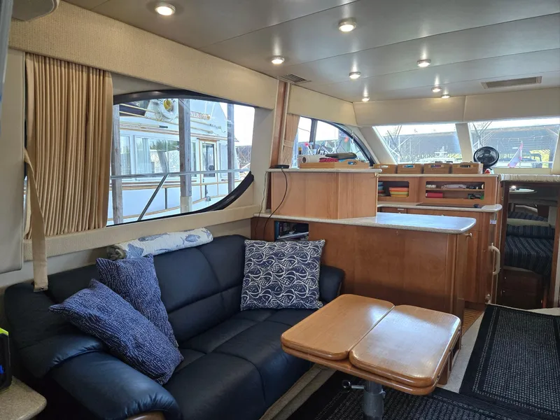 Slide: The Image of Interior of a 2004 Meridian 381 Sedan yacht with modern furnishings and ample natural light. - 35