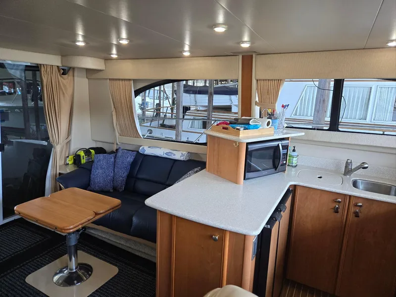 Slide: The Image of Interior of a 2004 Meridian 381 Sedan yacht with modern kitchen and seating area. - 39