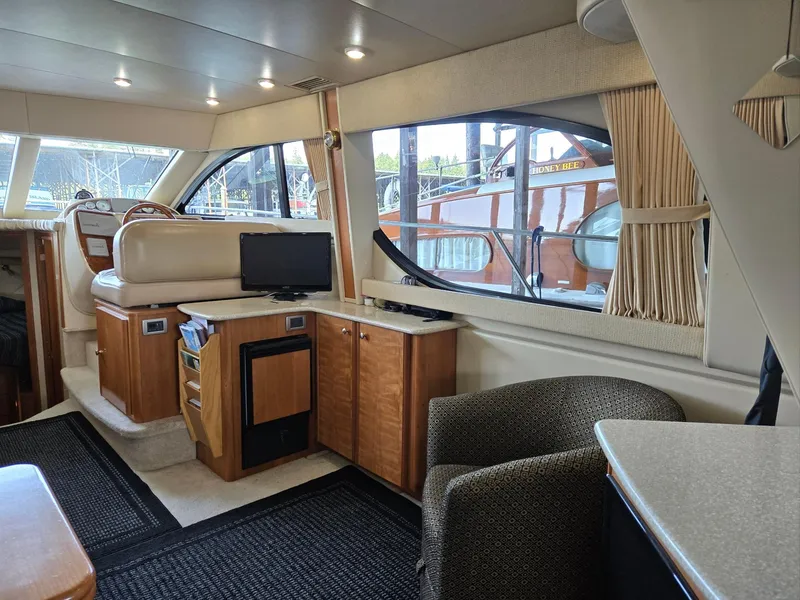 Slide: The Image of Interior of 2004 Meridian 381 Sedan yacht with modern furnishings and large windows. - 46