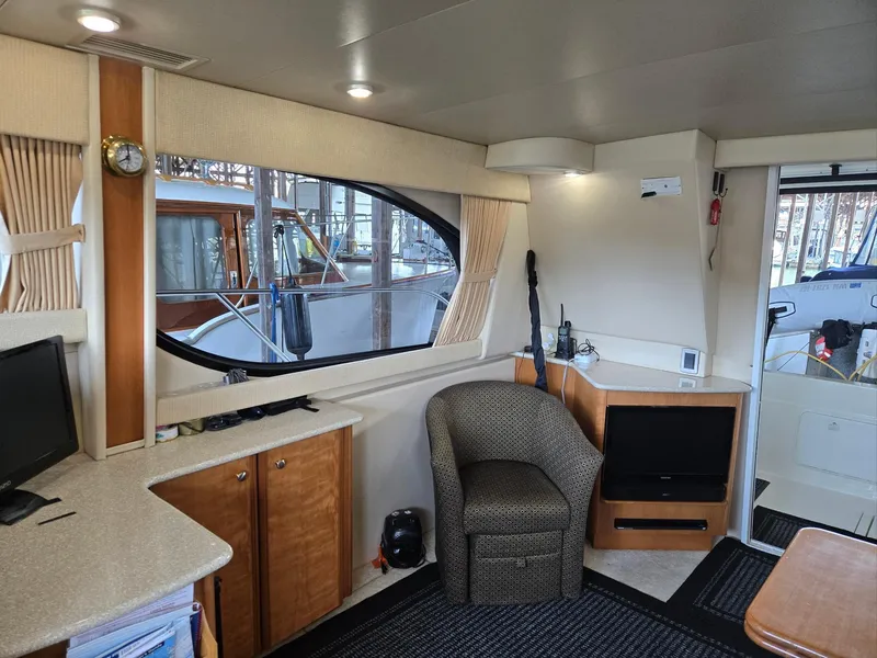 Slide: The Image of Interior of 2004 Meridian 381 Sedan yacht with cozy seating and modern amenities. - 47
