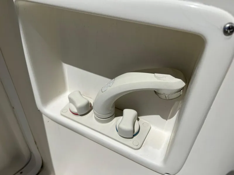 Slide: The Image of White faucet and knobs on a 1996 Tiara Yachts 4300 Open. - 12