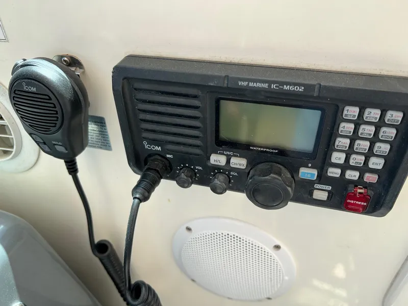 Slide: The Image of VHF marine radio on 1996 Tiara Yachts 4300 Open, featuring Icom IC-M602 model. - 23