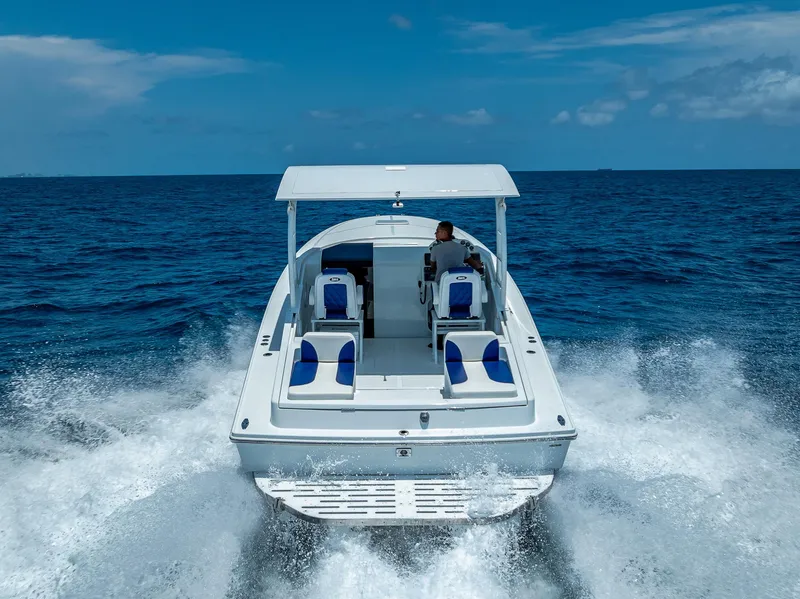 Slide: The Image of Nova 39 Sport 2020 boat cruising on open ocean, rear view with wake. - 19