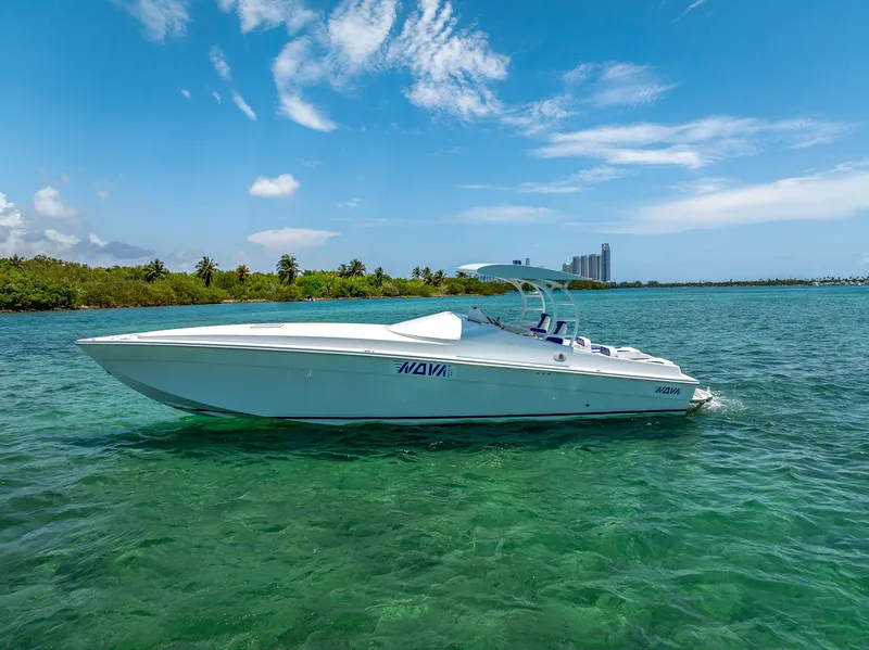 Slide: The Image of 2020 Nova 39 Sport boat on clear water under blue sky. - 2