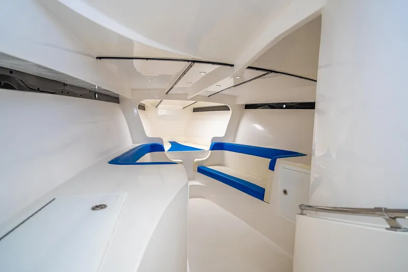 Slide: The Image of Interior of 2020 Nova 39 Sport boat, featuring sleek white and blue design. - 23