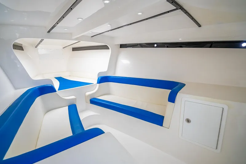Slide: The Image of Interior of 2020 Nova 39 Sport boat with blue and white seating. - 24