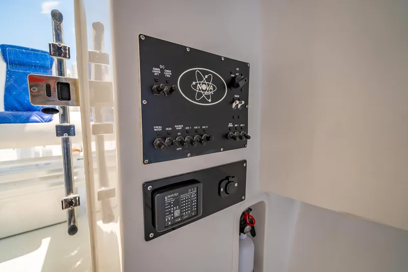 Slide: The Image of Control panel of a 2020 Nova 39 Sport boat, featuring switches and dials. - 30