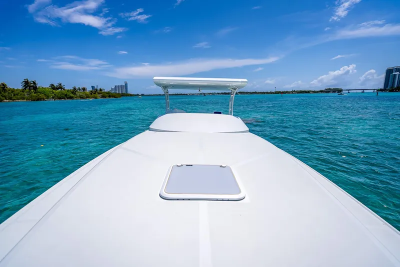 Slide: The Image of Nova 39 Sport 2020 boat cruising on clear blue ocean under sunny sky. - 32
