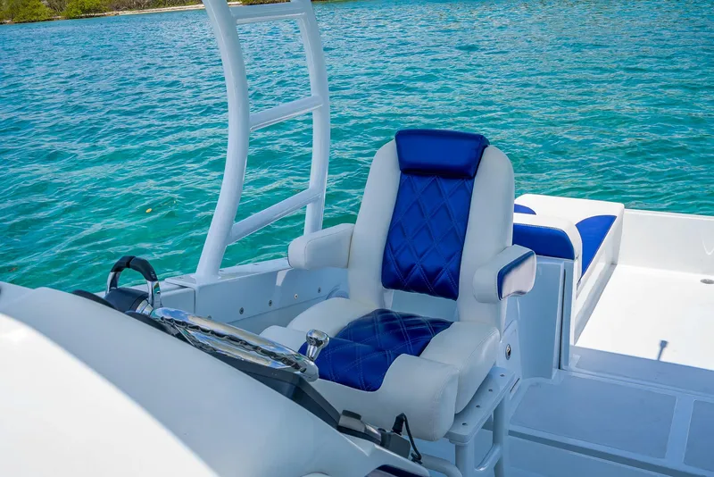 Slide: The Image of Luxurious seating on 2020 Nova 39 Sport boat with blue and white upholstery. - 35