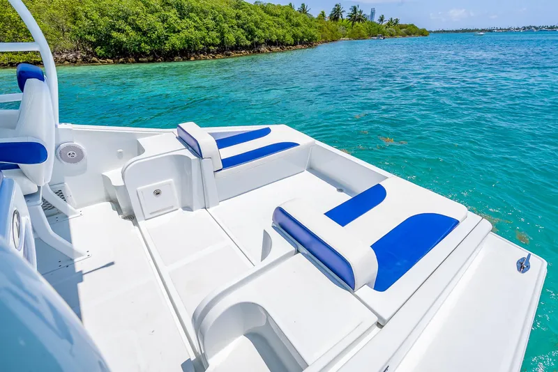 Slide: The Image of Nova 39 Sport 2020 boat with blue and white seating on clear turquoise water. - 39