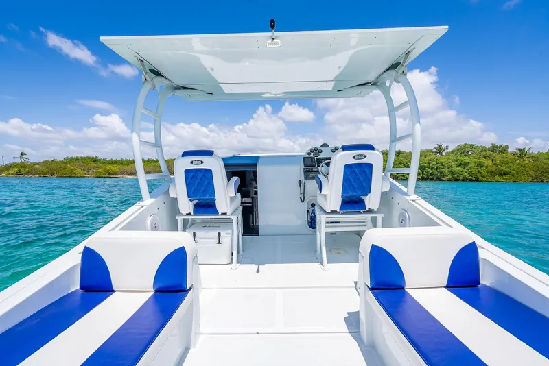 Slide: The Image of Nova 39 Sport 2020 boat interior with blue and white seating on clear water. - 40