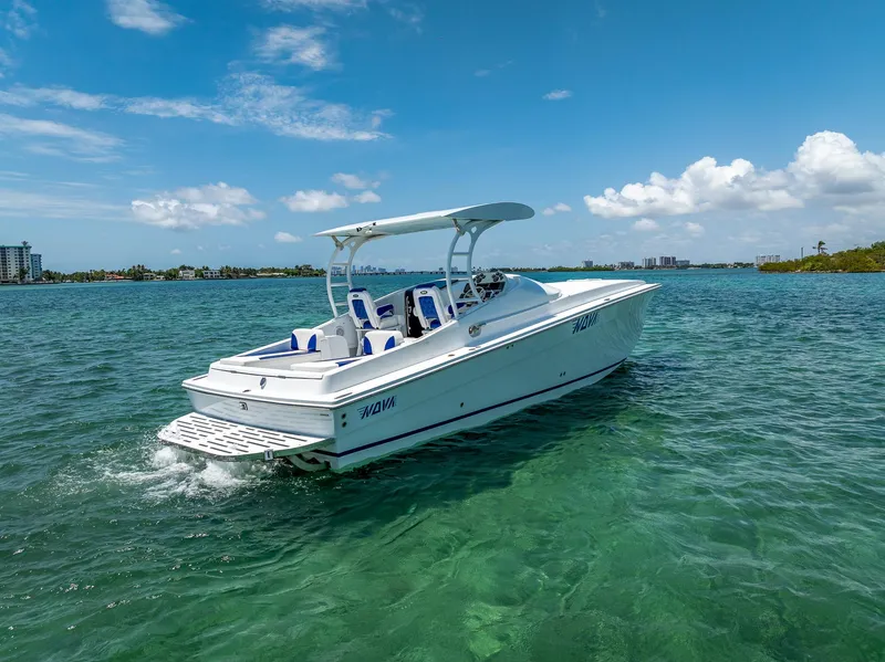 Slide: The Image of 2020 Nova 39 Sport boat cruising on clear blue water under a sunny sky. - 7
