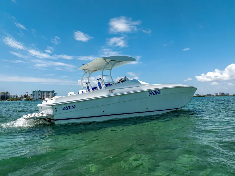 Slide: The Image of 2020 Nova 39 Sport boat cruising on clear blue water under a sunny sky. - 8