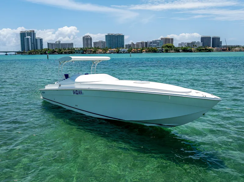 Slide: The Image of 2020 Nova 39 Sport boat on clear water with city skyline in background. - 9