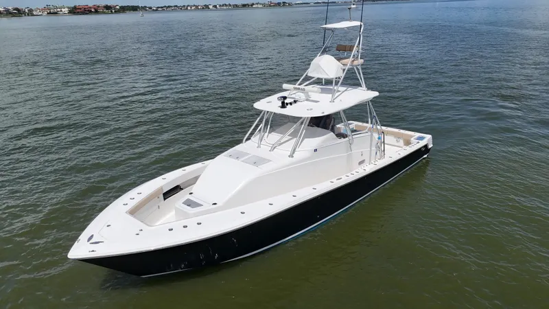 Slide: The Image of 2015 SeaVee 43 Fish-Around boat on calm water, aerial view. - 2