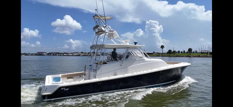 Slide: The Image of 2015 SeaVee 43 Fish-Around boat cruising on a sunny day with blue skies. - 31